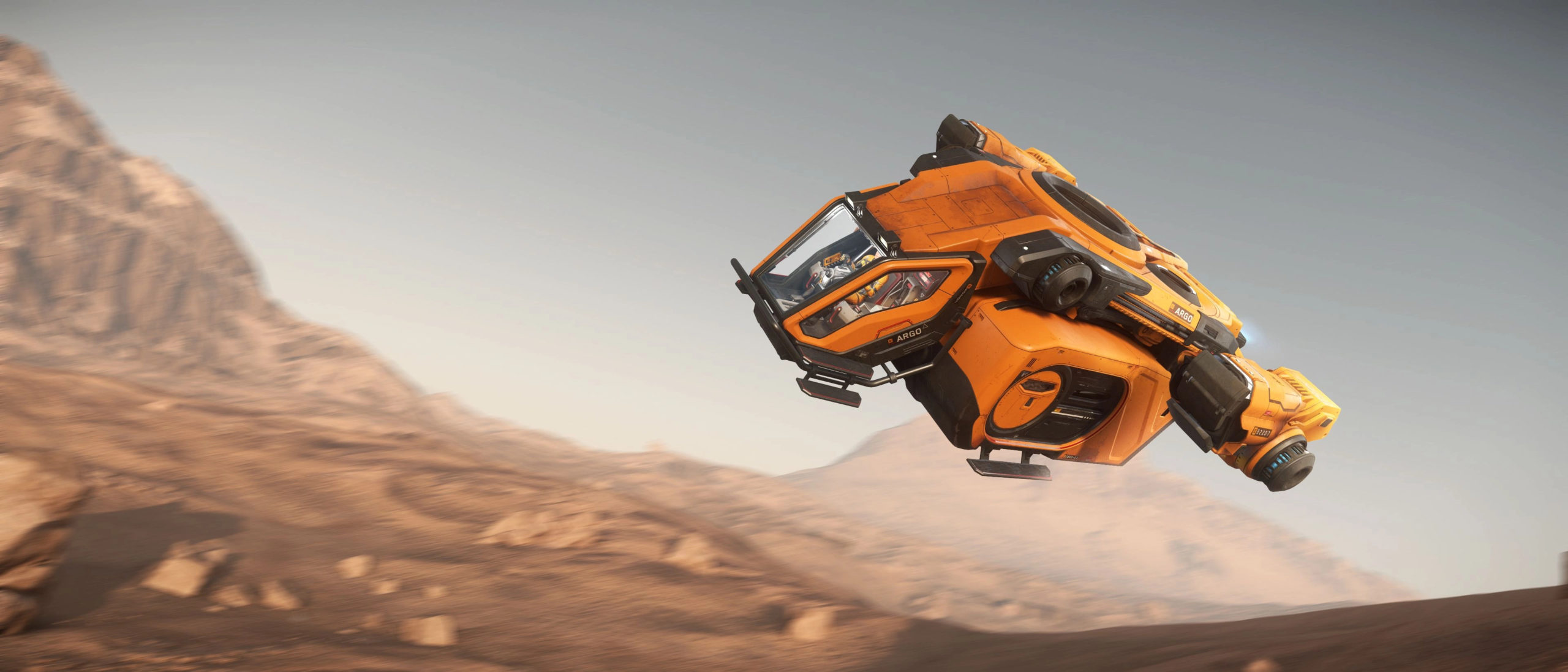 An orange Star Citizen car soaring over a mountain.