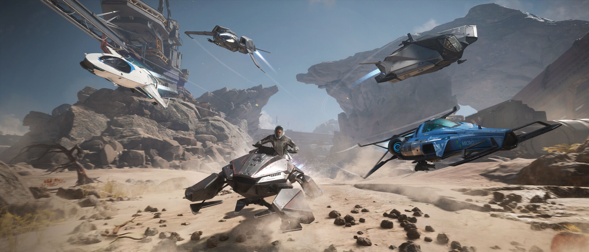 A fleet of Star Citizen vehicles soaring through a desert landscape.