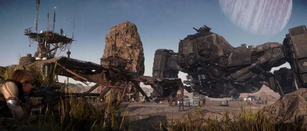 A soldier crouches in tall grass, observing a futuristic military base with large mechs and planetary structures in the background.